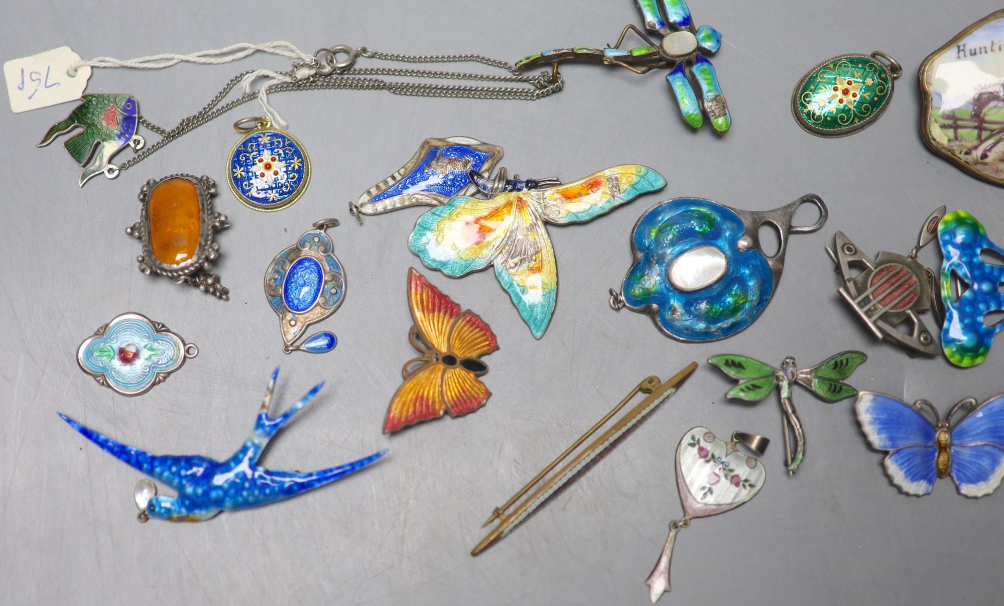 A mixed group of enamelled jewellery.